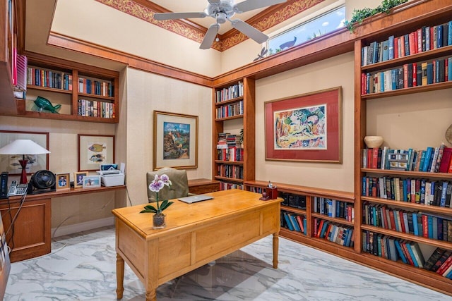 office featuring marble finish floor and ceiling fan