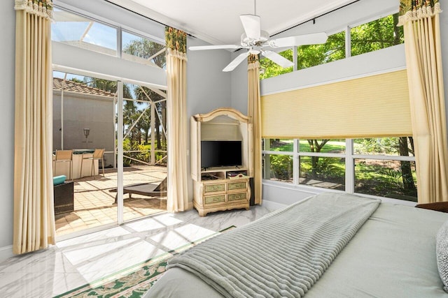 bedroom featuring marble finish floor and access to outside