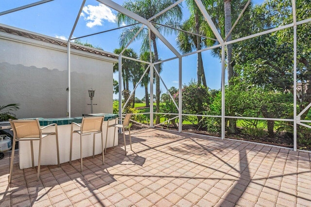 view of patio with a lanai