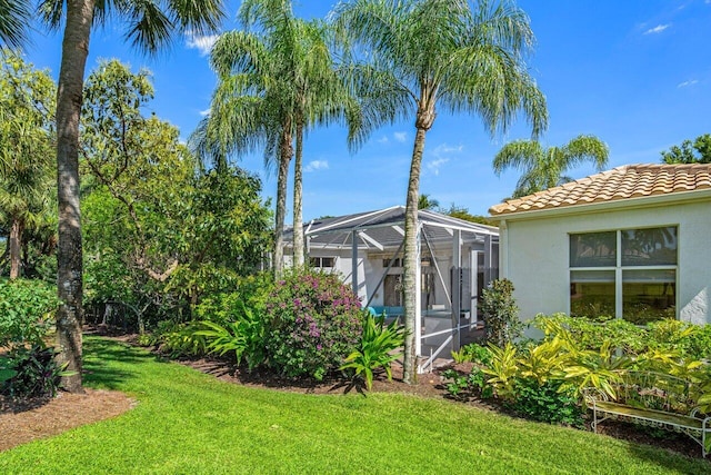 view of yard with a lanai