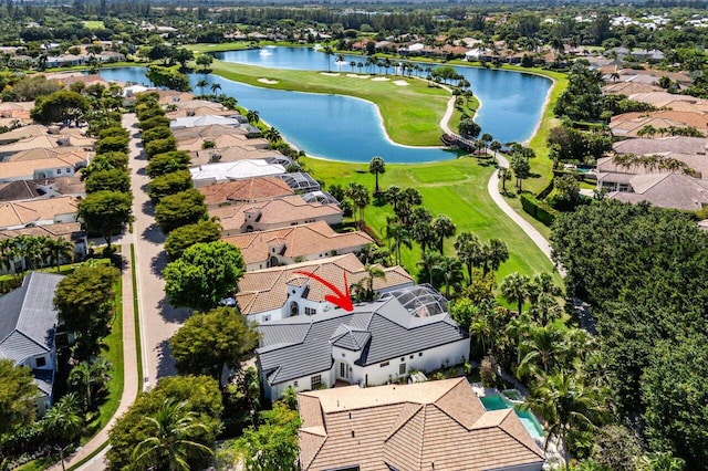 bird's eye view with a residential view, golf course view, and a water view