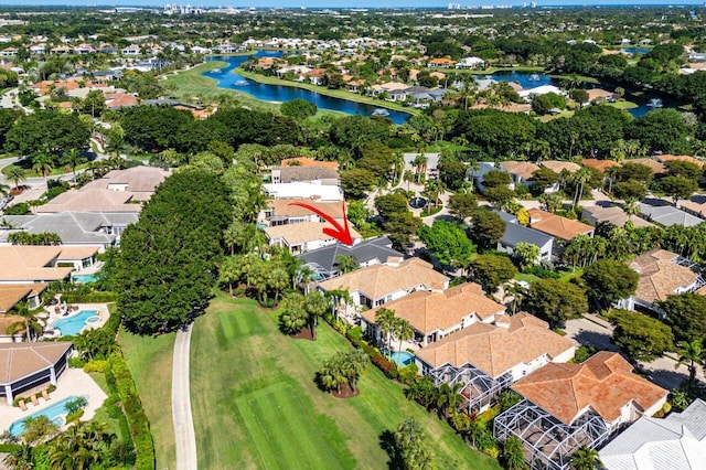 birds eye view of property with a residential view and a water view