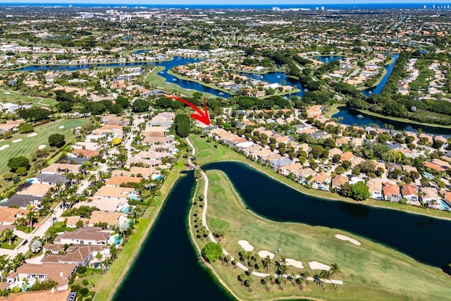 birds eye view of property featuring a residential view, a water view, and golf course view