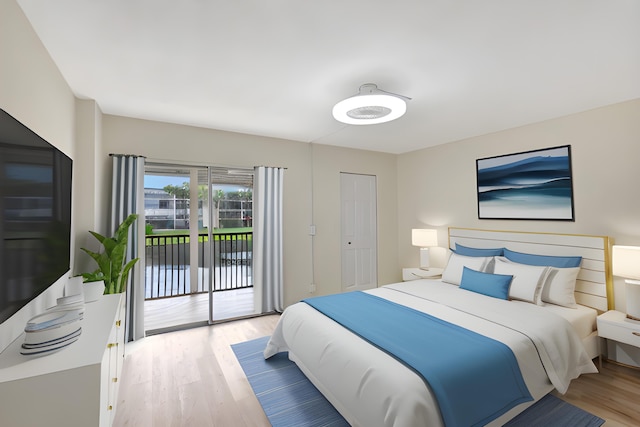 bedroom featuring light wood-type flooring and access to exterior