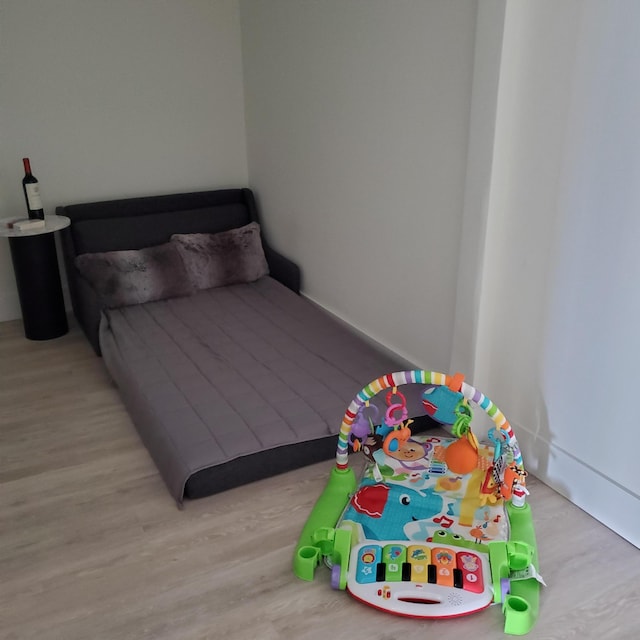 bedroom with wood finished floors