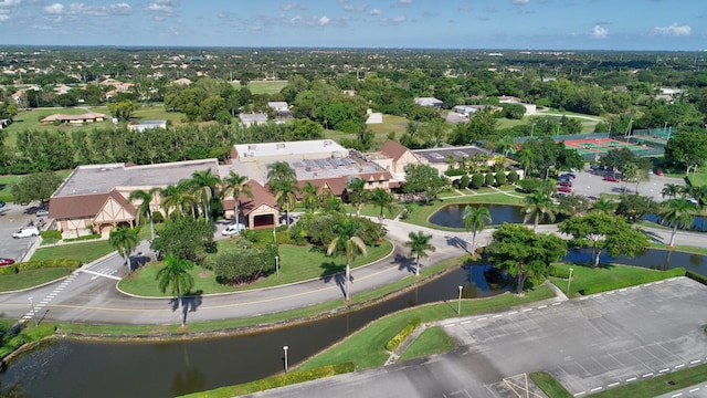 drone / aerial view with a residential view and a water view