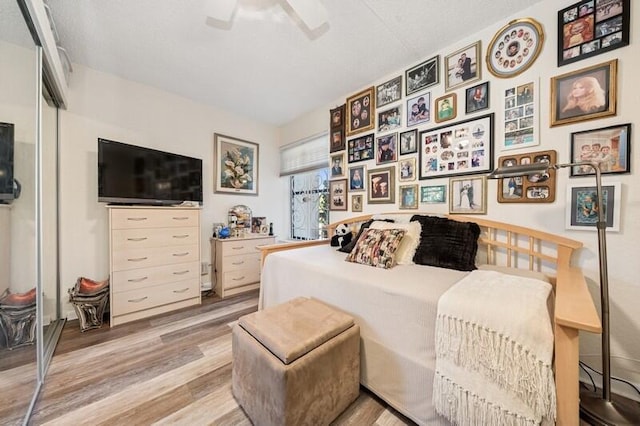 6562 Boca Del Mar Dr Unit 321, Boca Raton, FL 33433 - bedroom with a closet, light wood-style floors, and a ceiling fan