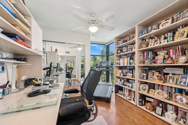 6562 Boca Del Mar Dr Unit 321, Boca Raton, FL 33433 - home office with wood finished floors, a textured ceiling, and ceiling fan