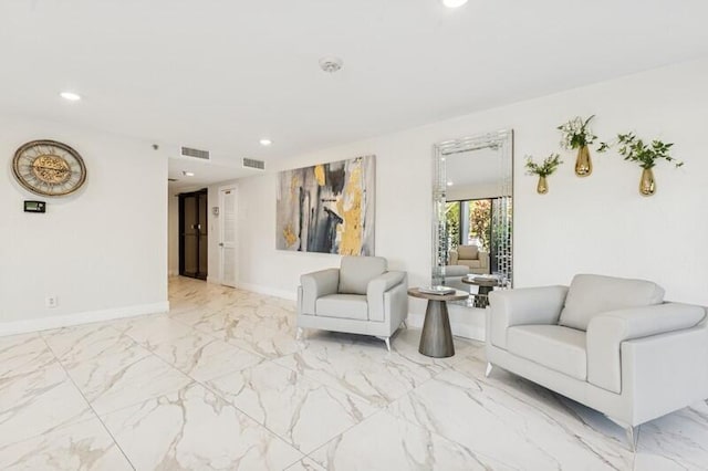 living room featuring recessed lighting, visible vents, baseboards, and marble finish floor