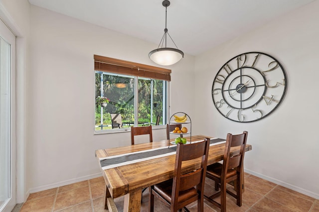 dining room featuring baseboards