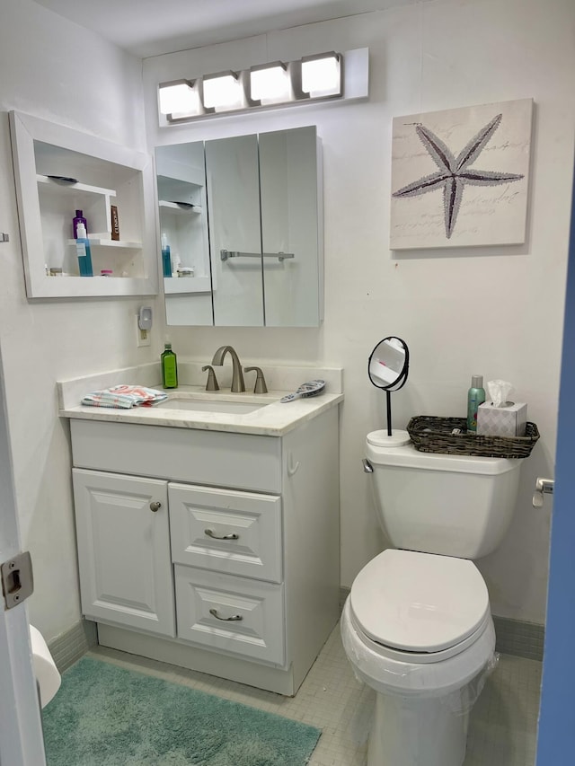 half bathroom with toilet and vanity