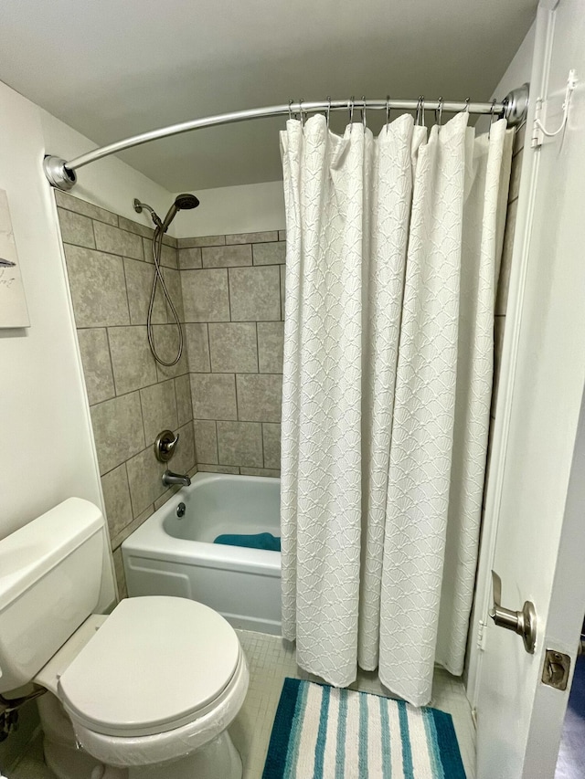 bathroom with shower / bath combo with shower curtain and toilet