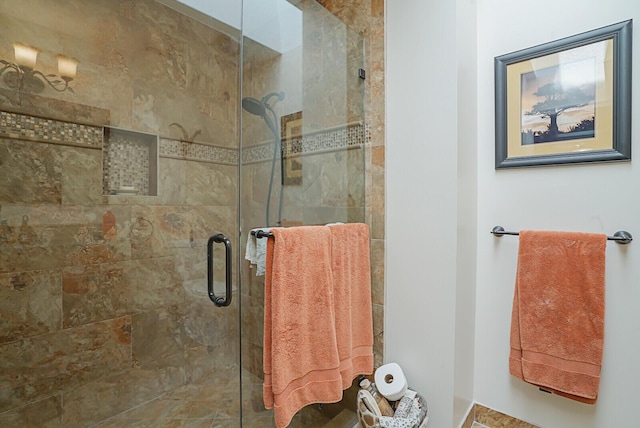 bathroom with a shower stall