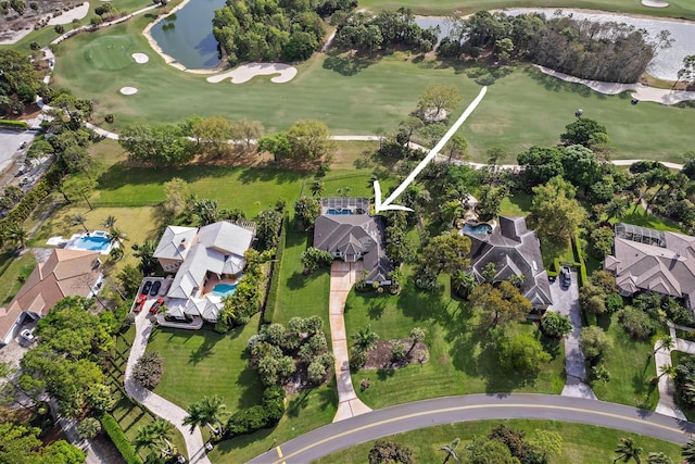 drone / aerial view with a residential view and view of golf course