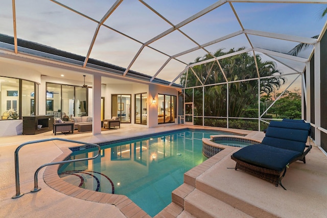 view of pool featuring ceiling fan, a patio area, a pool with connected hot tub, and an outdoor hangout area