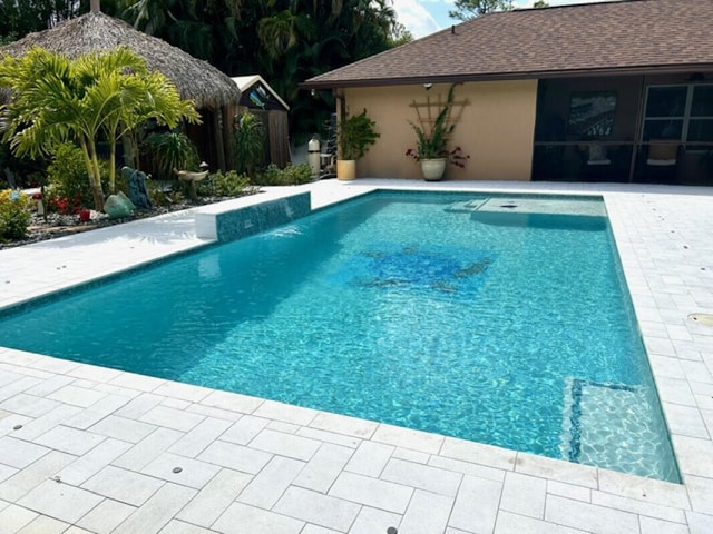 pool featuring a patio area