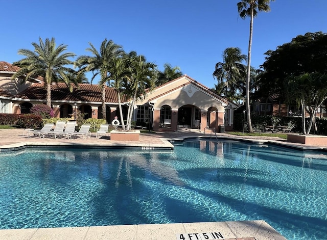 community pool featuring a patio