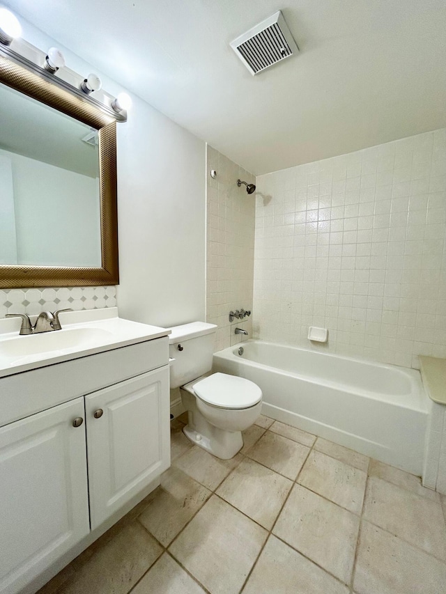 bathroom with shower / bath combination, visible vents, vanity, and toilet