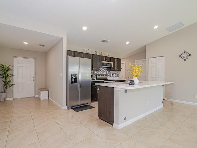 kitchen with light countertops, visible vents, decorative backsplash, appliances with stainless steel finishes, and light tile patterned flooring