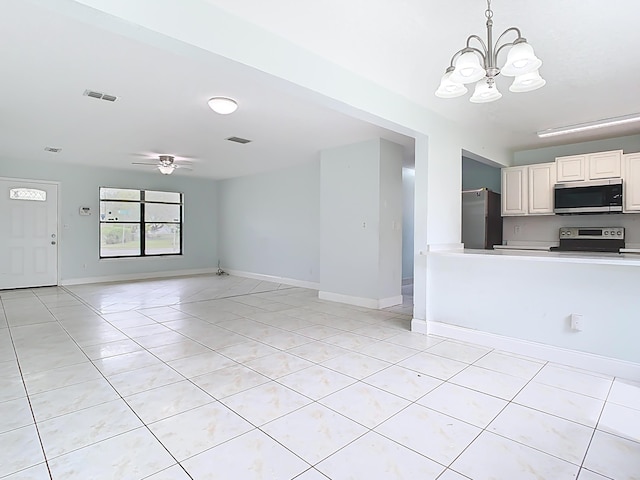 unfurnished living room with light tile patterned floors, visible vents, and baseboards