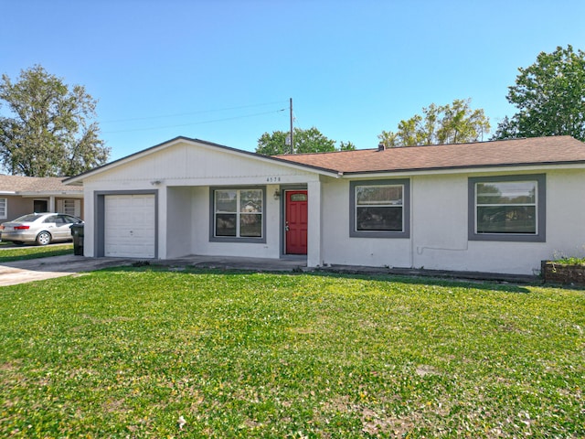 single story home featuring stucco siding, a front yard, concrete driveway, and an attached garage