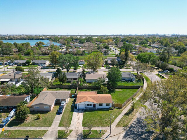 drone / aerial view featuring a residential view and a water view