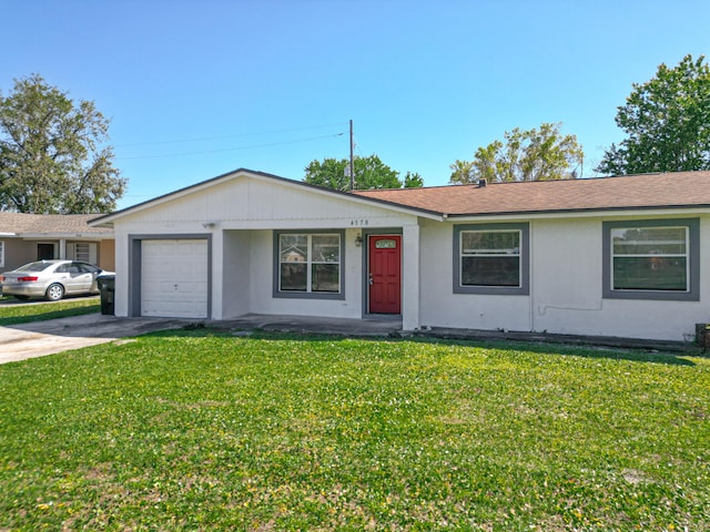 ranch-style house featuring a front lawn, a garage, and driveway