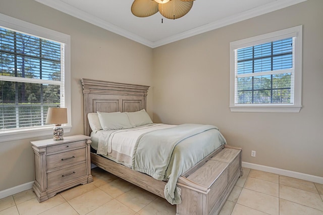 bedroom featuring ornamental molding, multiple windows, and baseboards