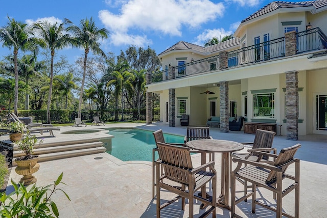 view of pool with a patio area, fence, a ceiling fan, and a fenced in pool