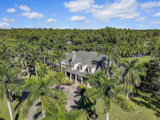 bird's eye view featuring a wooded view