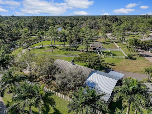 birds eye view of property featuring a wooded view