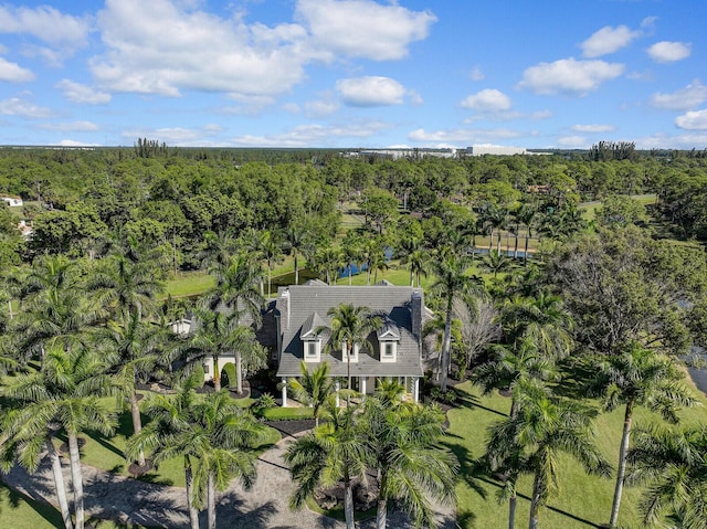 drone / aerial view featuring a forest view