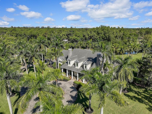 drone / aerial view with a view of trees