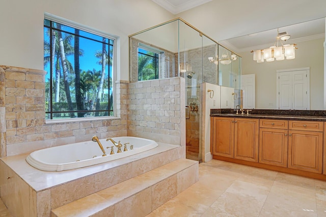 bathroom with a shower stall, a tub with jets, crown molding, and vanity