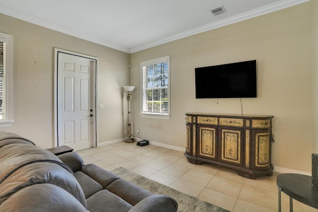 living room featuring baseboards, ornamental molding, and light tile patterned flooring