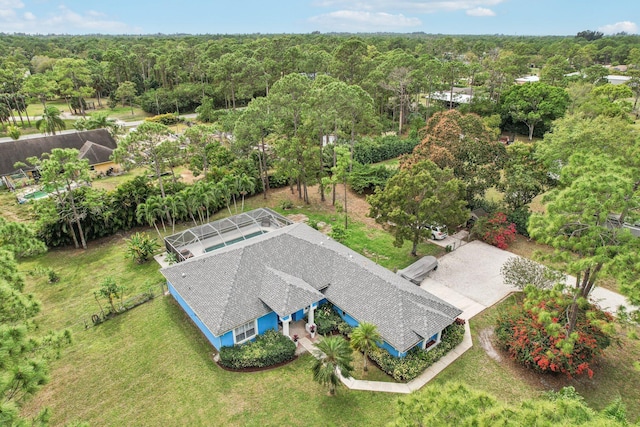 drone / aerial view featuring a view of trees