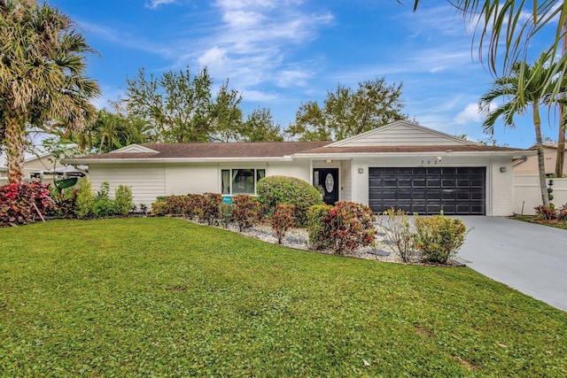 single story home with a garage, concrete driveway, brick siding, and a front lawn