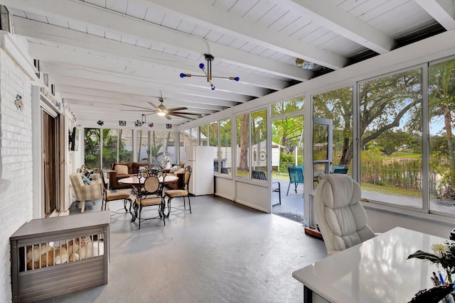 sunroom featuring beamed ceiling and a ceiling fan