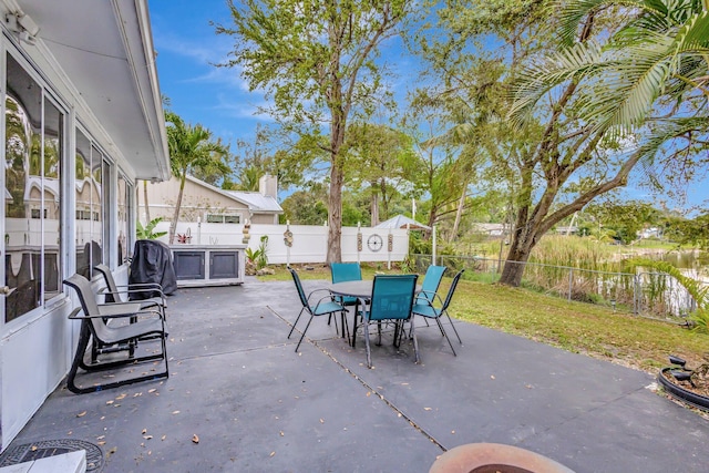 view of patio with outdoor dining area and a fenced backyard