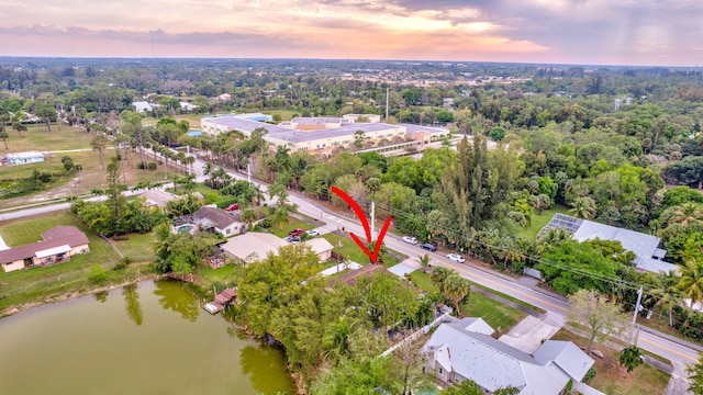 aerial view at dusk with a water view