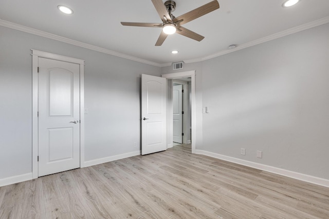 unfurnished bedroom featuring baseboards, visible vents, and ornamental molding