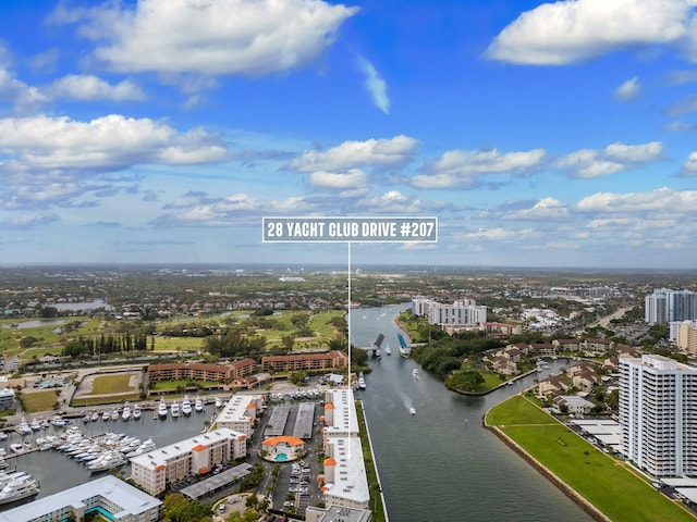 drone / aerial view featuring a water view and a city view