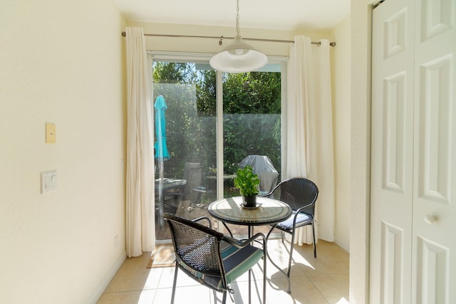 dining area with light tile patterned floors