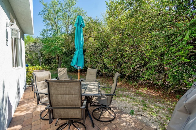 view of patio featuring outdoor dining area