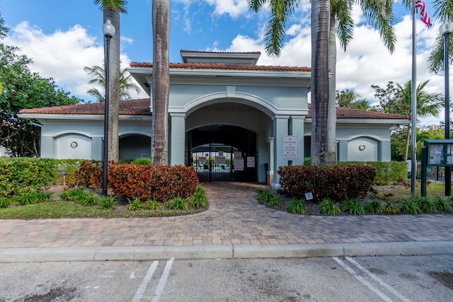 view of building exterior with uncovered parking