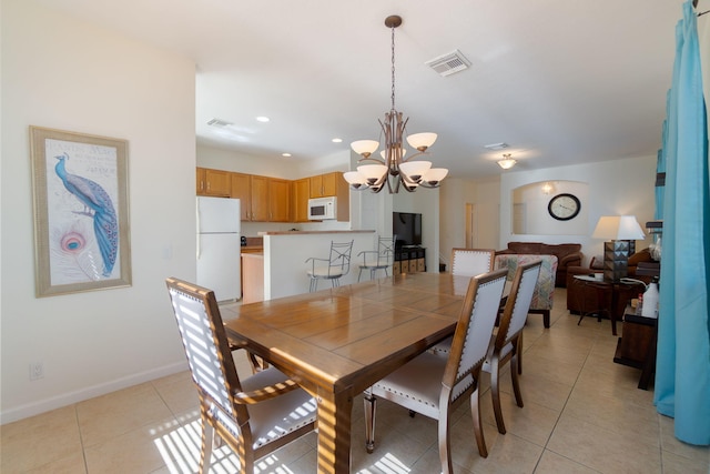 dining space featuring visible vents, baseboards, light tile patterned floors, recessed lighting, and a notable chandelier