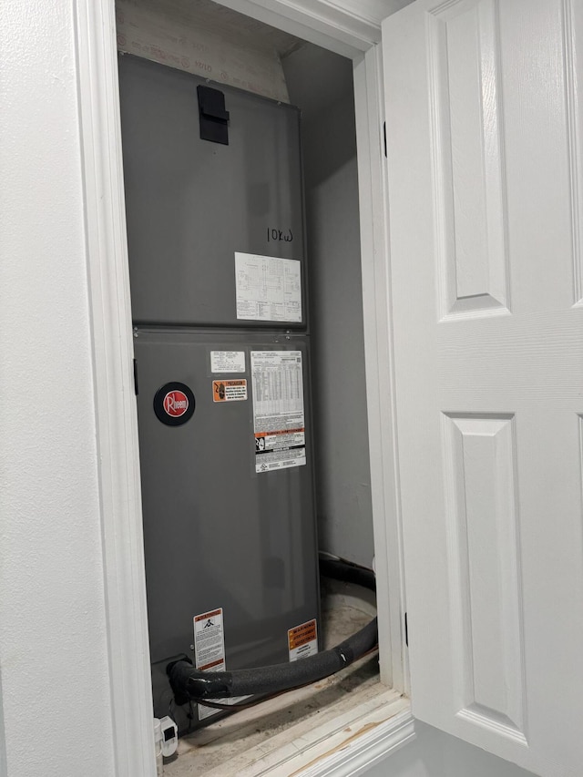 utility room with heating unit