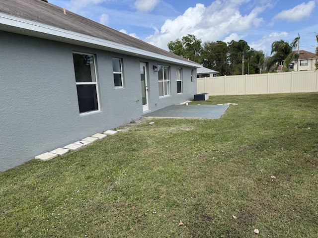 view of yard featuring a patio area and fence