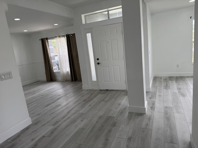 foyer entrance featuring recessed lighting, baseboards, and wood finished floors