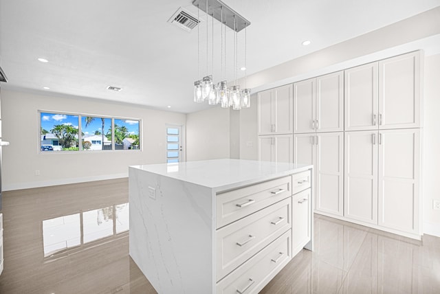 spacious closet featuring visible vents